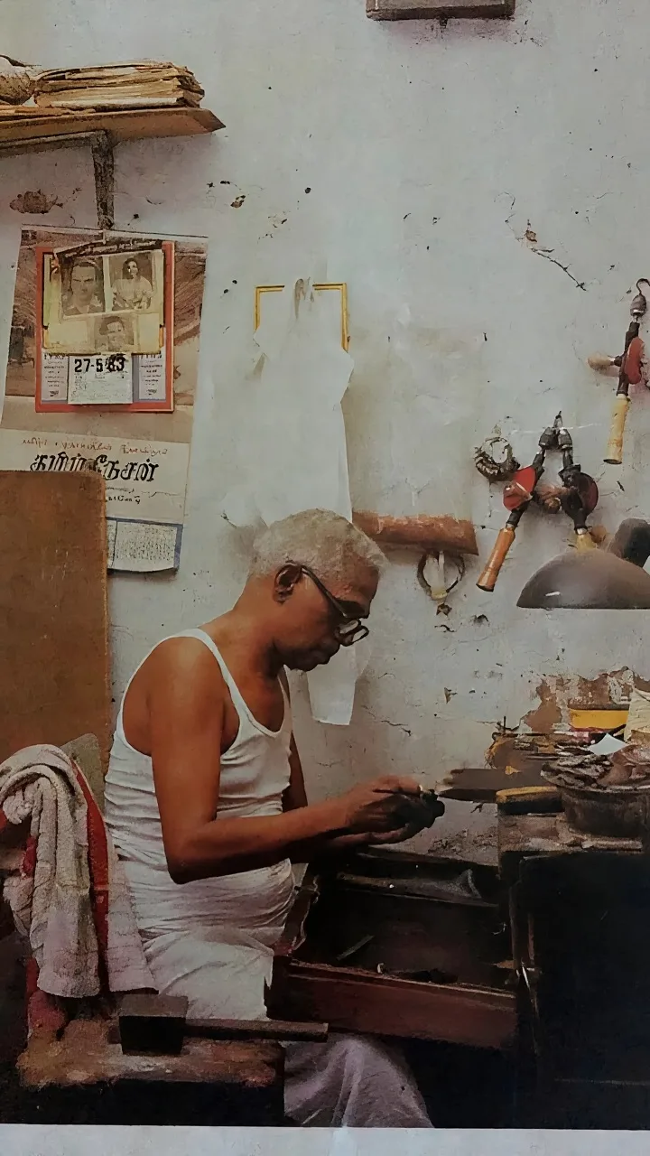 Ranjinis' grandfather, a traditional goldsmith, at work